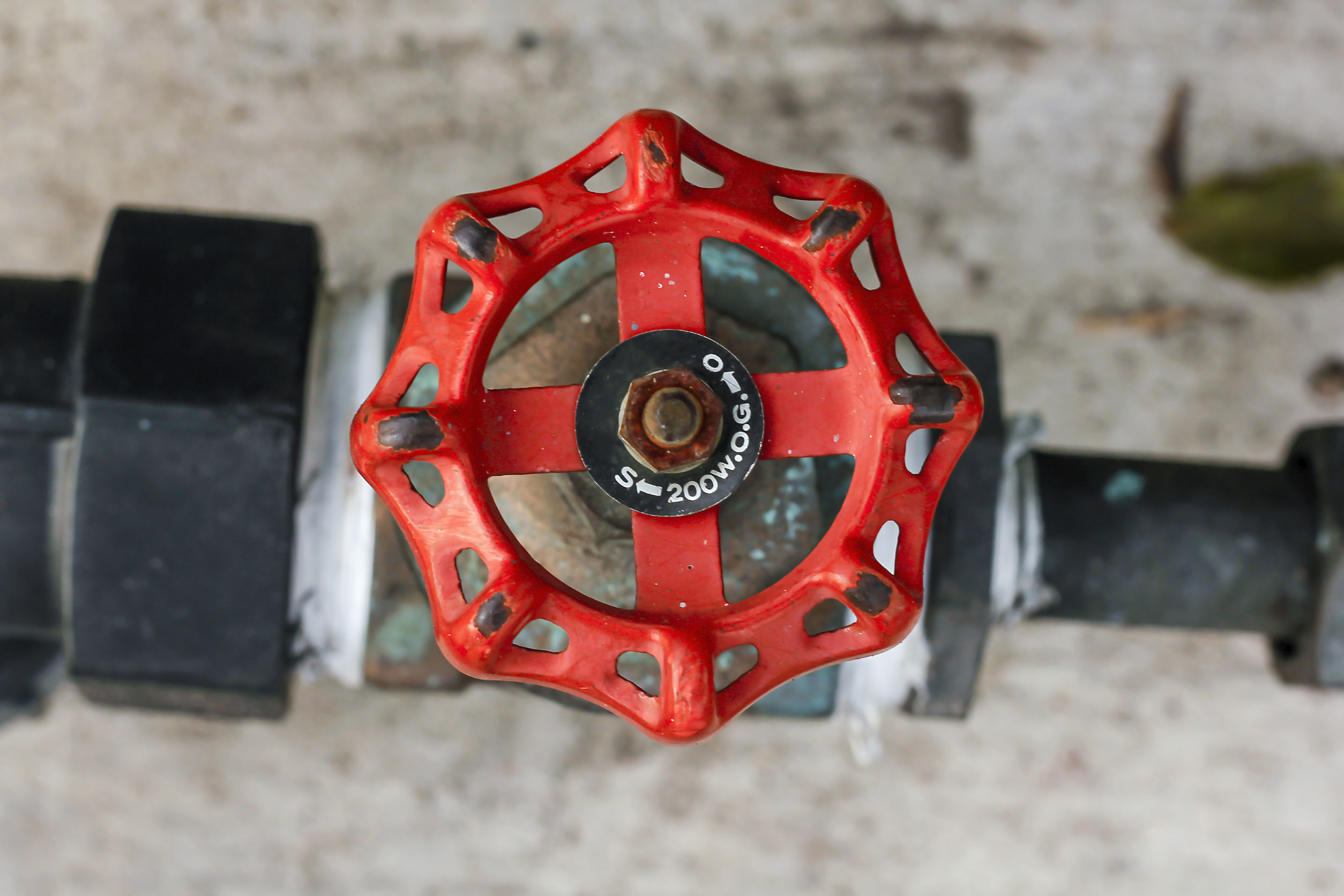 Close up of a red emergency water shutoff valve